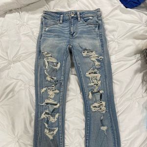 American eagle stretchy skinny jeans, semi high waisted, ripped at the bottom